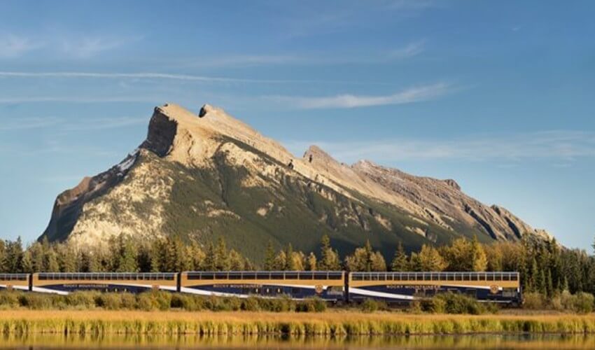 Train traveling across the Canadian Rockies.