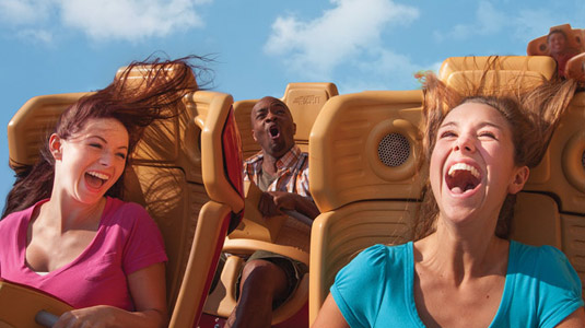 Teenagers on rollercoaster ride