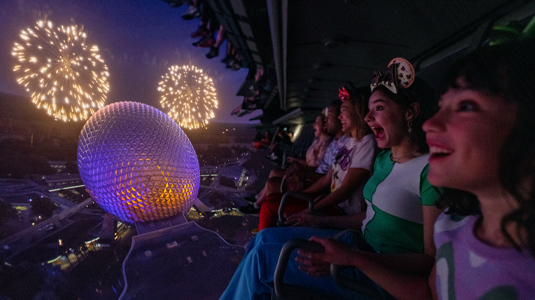 Image of kids watching Disney fireworks display.