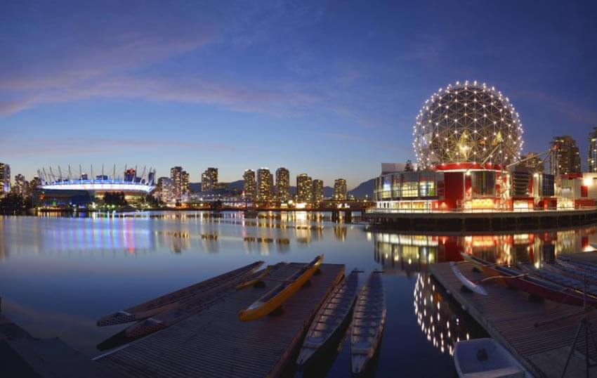 Vancouver Science World and BC Stadium at night.