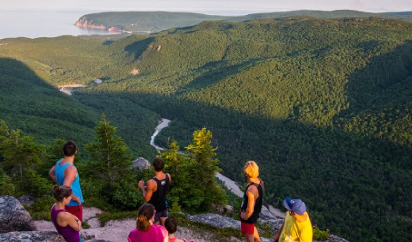 Tourists enjoy view of Cape Breton Highlands National Park, Nova Scotia.