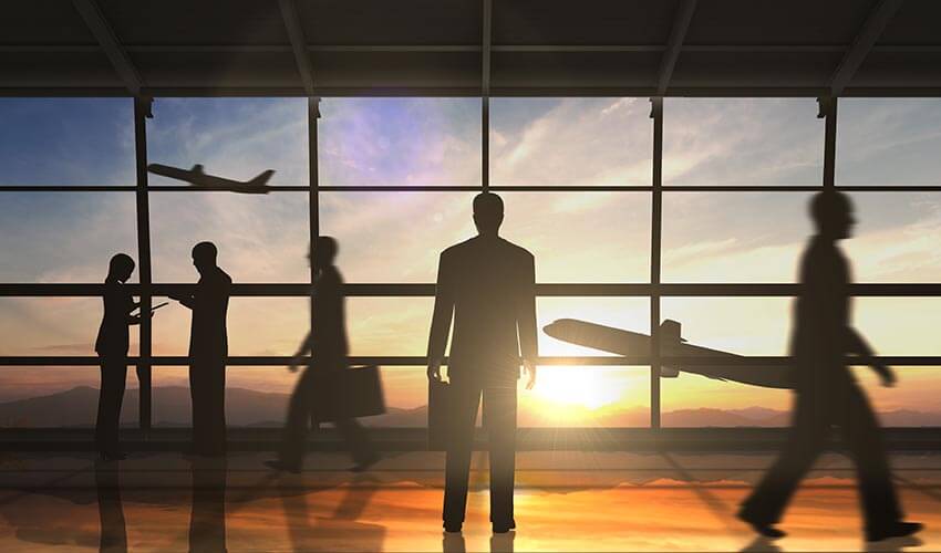 Business man standing and business group silhouette in the airport
