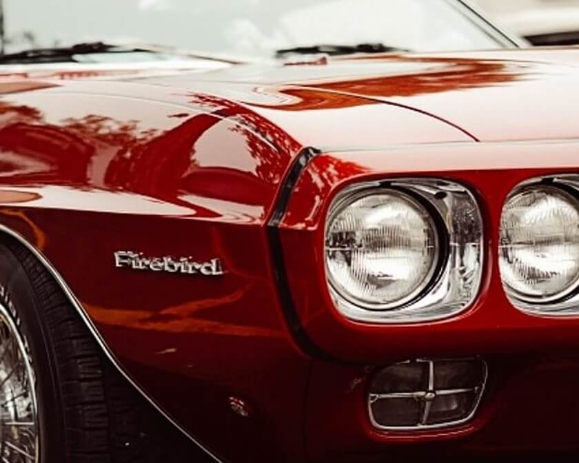 Close up of a classic Firebird car.