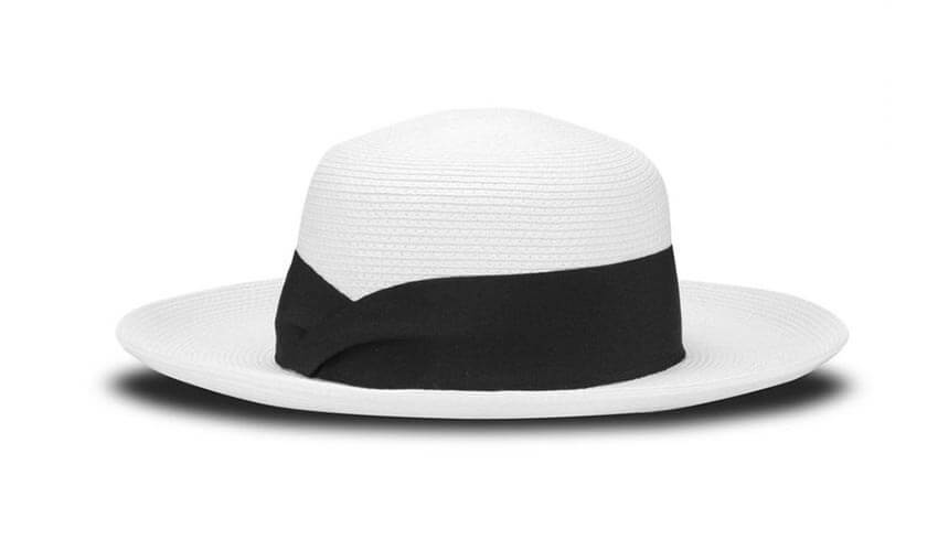 A white Tilley TOY1 Women’s Audrey sun hat with black trim.