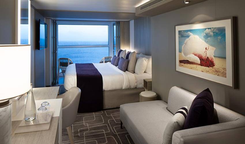The Concierge Class room with a balcony, large bed and sofa.
