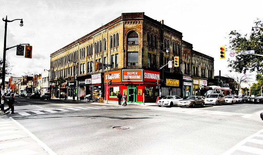 Keele and Dundas junction in Toronto traffic intersection with cars and pedestrians.