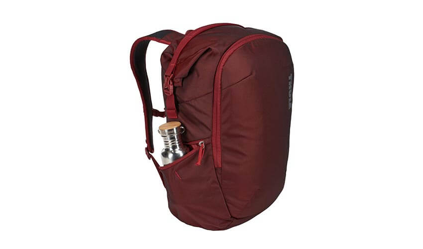 A wine coloured Thule Subterra travel backpack