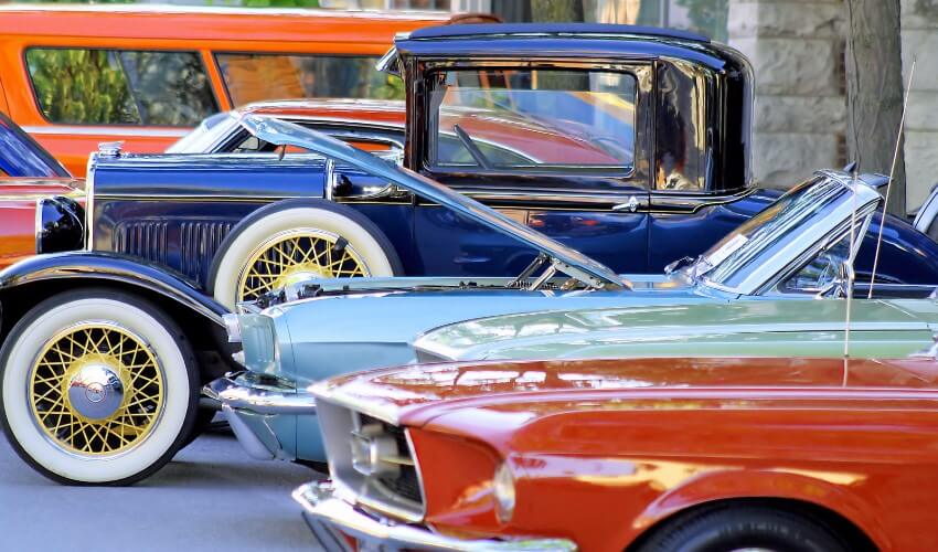 Classic cars parked along a street.
