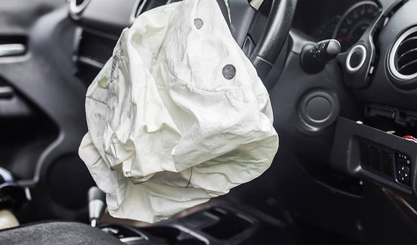 A car airbag deployed in an accident.