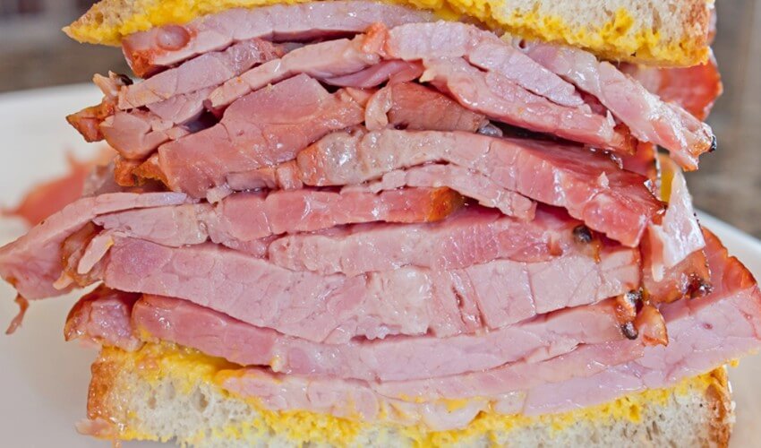 Juicy Montreal smoked meat on light rye.