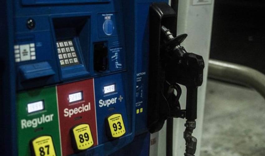 Fuel pumps at a gas station during night time.