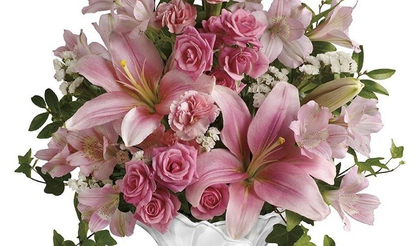 A close up of a bouquet of pink roses