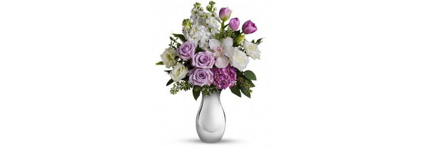 A bouquet of purple roses and hydrangea