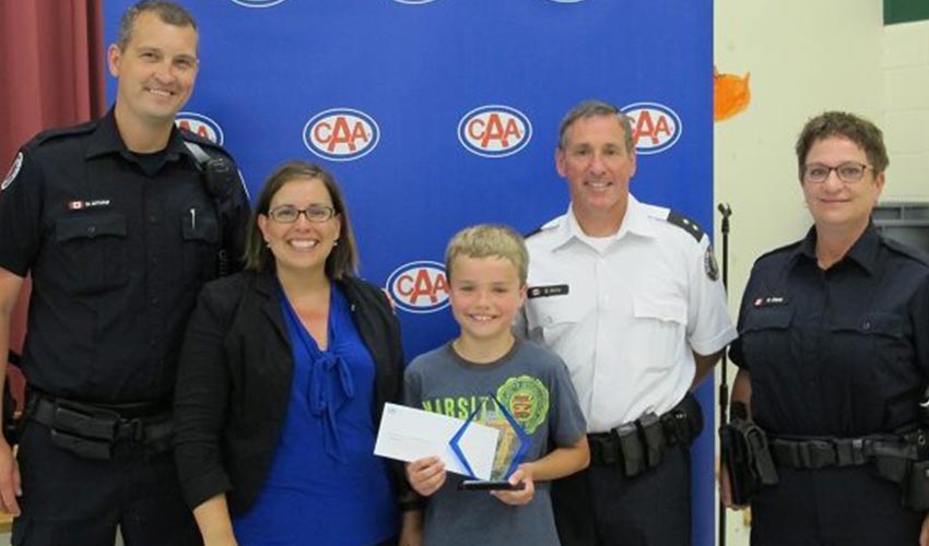CAA School Patroller of the Year, Derek Winget posing in a group photo.