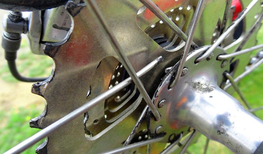 Broken wheel spoke on bicycle.