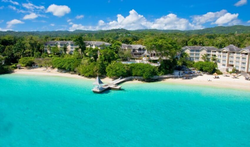 Sandals beach resort with clear blue waters.