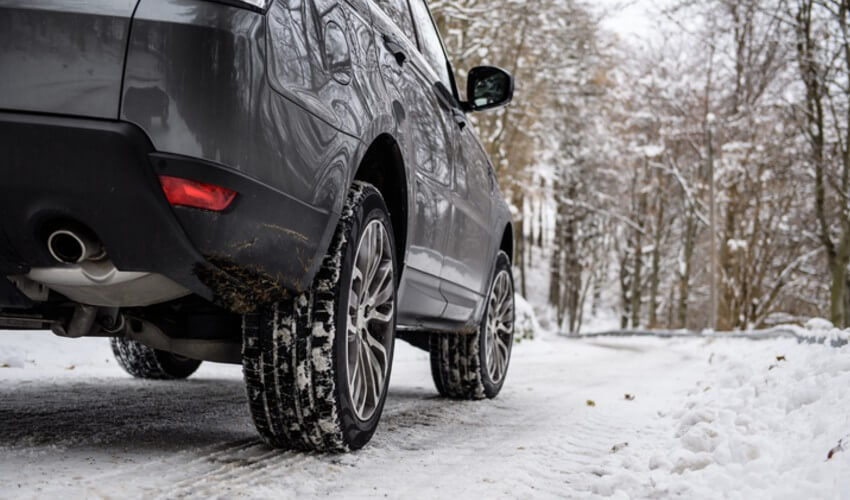 Close-up of winter car tires mounted on a sport utility vehicle.
