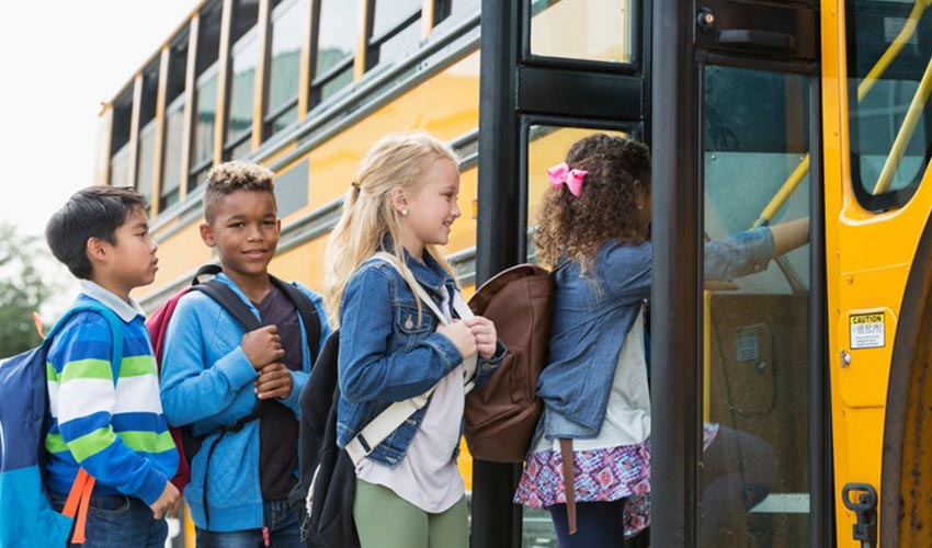 Students boarding a school bus.