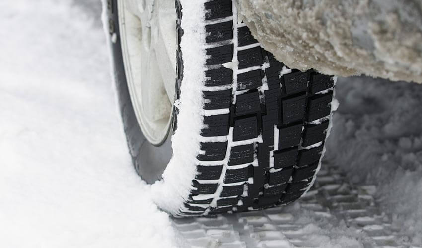 A closeup of a snow tire.