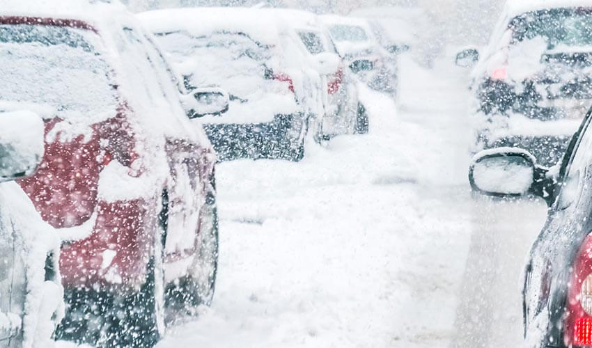 Cars stick in traffic jam during a snow storm.