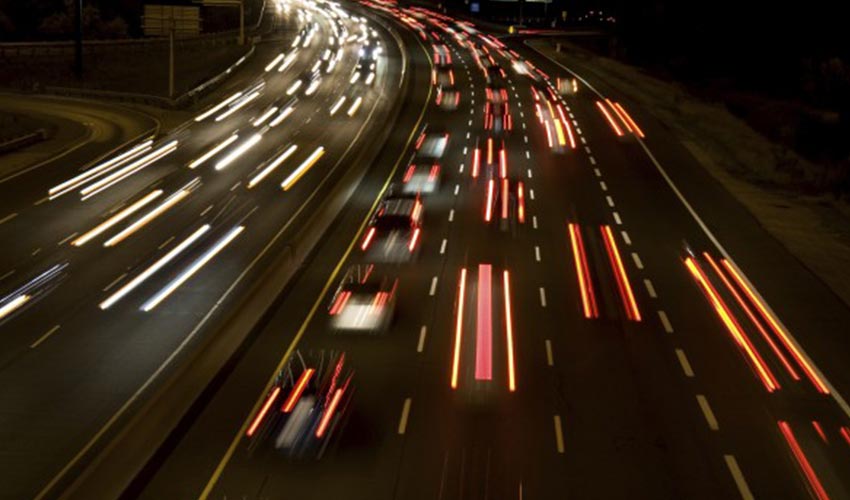 A busy highway at night.