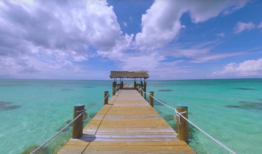 A dock surrounded by clear waters at Compass Point, New Providence Island.