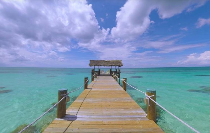 A dock surrounded by clear waters at Compass Point, New Providence Island.