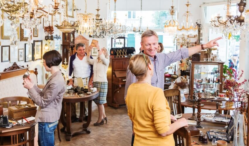 People shopping inside an antique store.