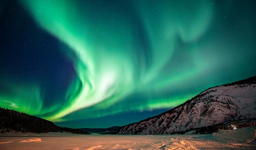 Green mysterious Northern Lights in Yukon.