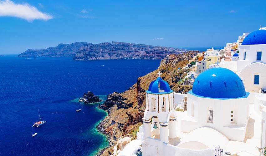 View of blue and white architecture and coastal waters in Santorini