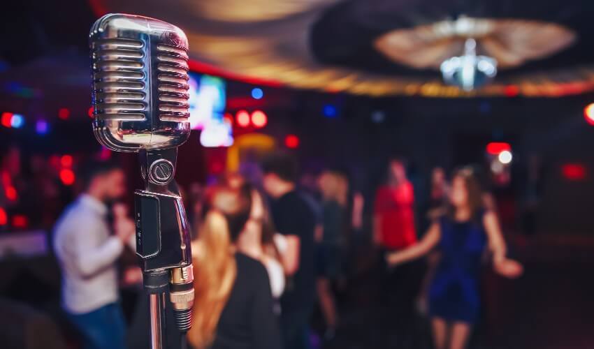 Retro microphone against a blurred restaurant background.