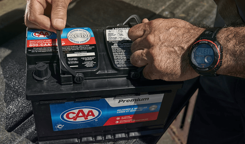 A CAA battery held by a technician.
