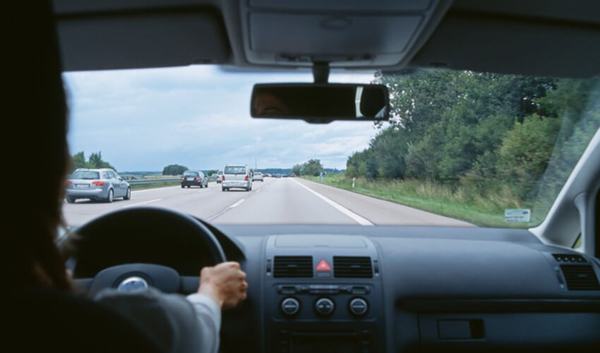 Car traveling on multiple lane highway