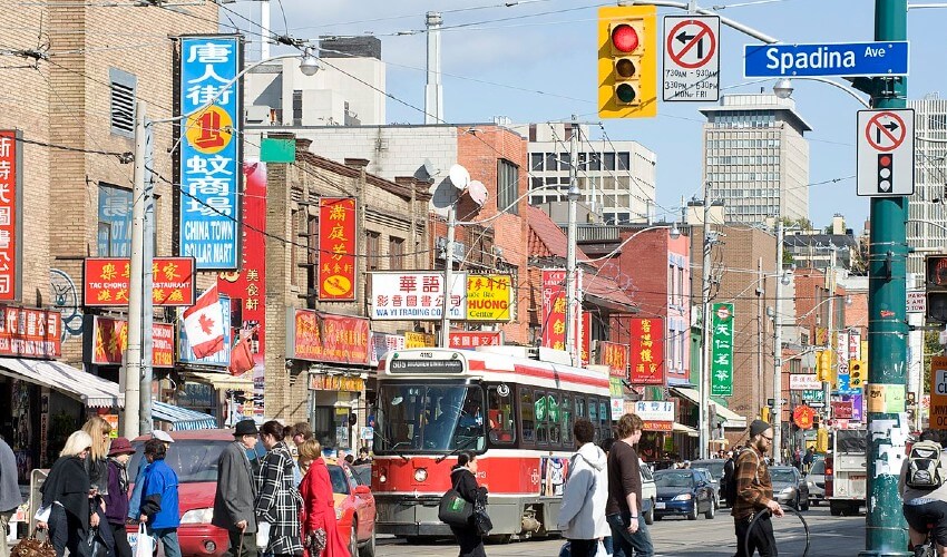 People walking around Toronto Chinatown.