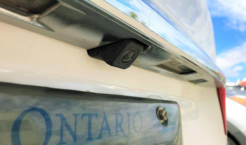 A car''s rear view camera above license plate.