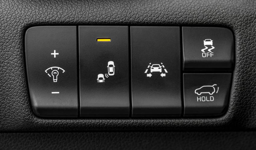 Switches inside a car to activate or disable safety features.