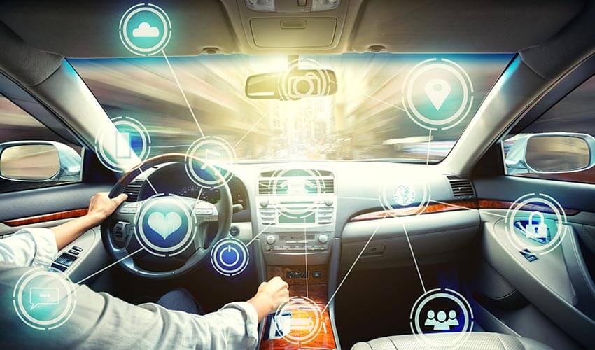 A driver in an interior of a car with superimposed icons symbolizing all the technology features of the vehicle.