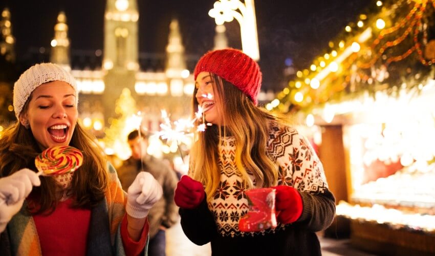 Girlfriends having fun at a Christmas market.
