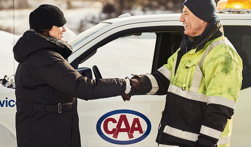 CAA driver shaking hands with a customer.