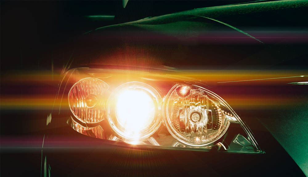 Closeup of illuminated car headlight