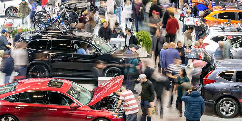 A crowd explores exhibits at the Canadian International AutoShow in Toronto, Ont.