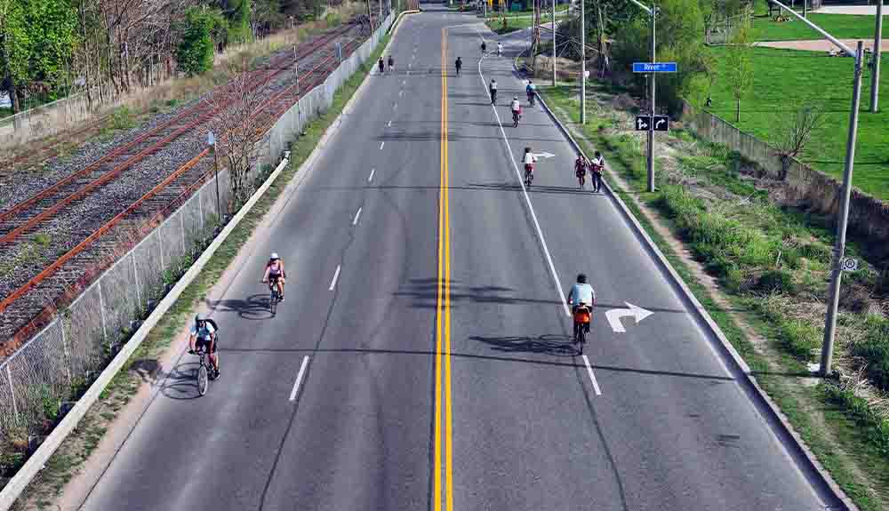 Cyclists use bike lanes on an otherwise empty road in Toronto, Canada