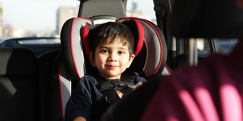 A child sitting in a car seat.