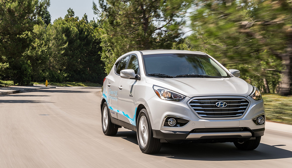 Hyundai Tucson driving on the side of the road