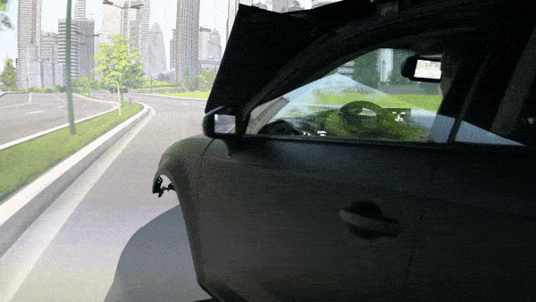 Woman drives test vehicle on a simulated freeway