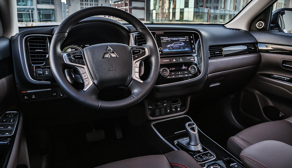 Shot of the luxurious and spacious black leather interior of the 2018 Mitsubishi Outlander PHEV hybrid SUV