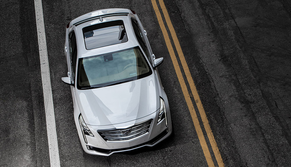 Bird's eye view of silver 2018 Cadillac CT6 Platinum driving down freeway