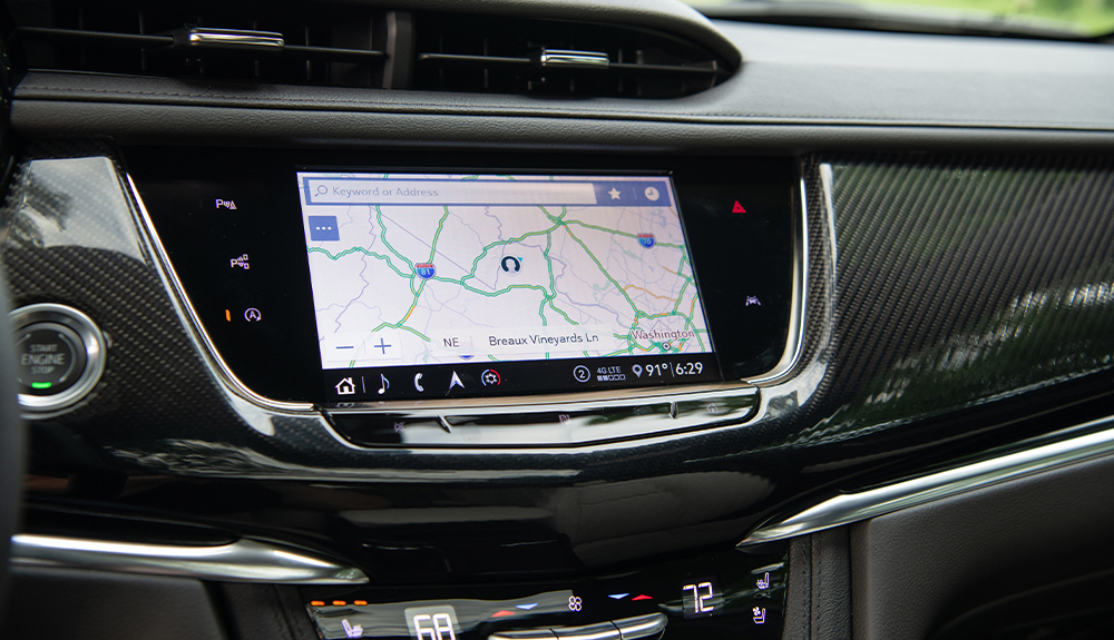 The Cadillac XT6's 8" touchscreen shows a map