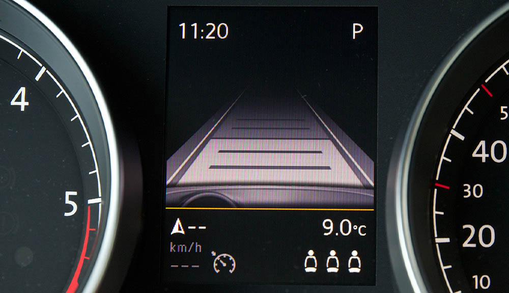 A dashboard view of the adaptive cruise control setting shows how much space is between the cars.