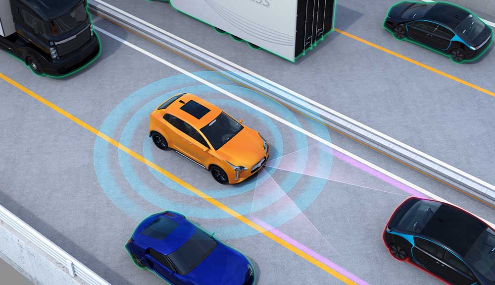 An illustration shows the range of the sensors that determine when automatic braking is needed.